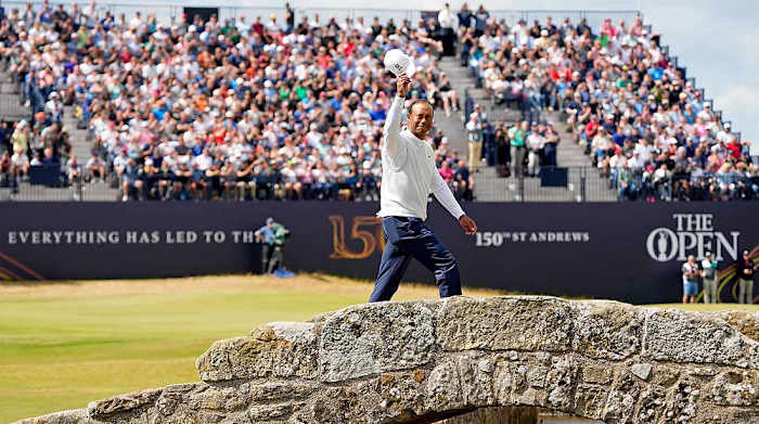 Tiger Woods walks across the famous Swilcan Bridge on the 18th hole at St. Andrews' Old Course on Friday of the 2022 British Open.